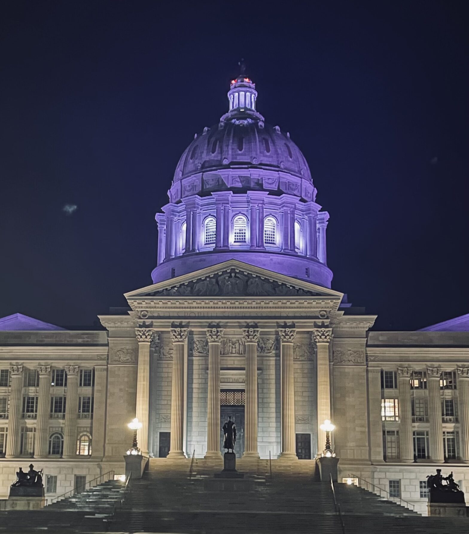 Missouri Capitol building lit up purple