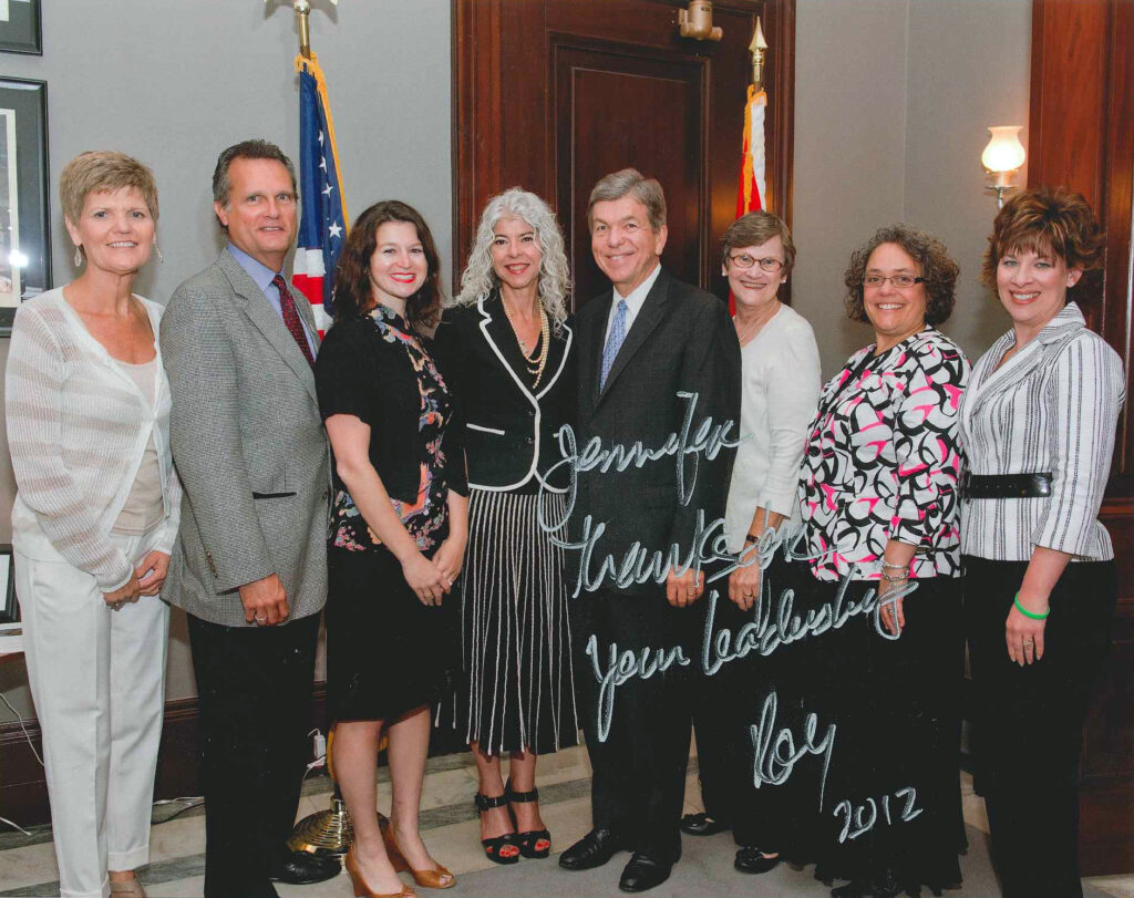 Signed image of Coleen Coble and Jennifer Carter Dochler with Senator Roy Blunt